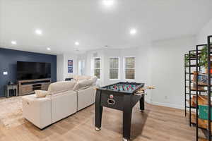 Recreation room featuring recessed lighting and light wood-style flooring