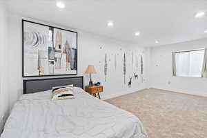 Bedroom featuring recessed lighting and carpet flooring