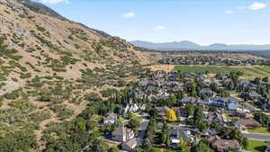 Aerial view of residential area featuring mountains