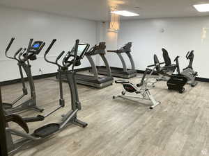 Gym with wood finished floors and baseboards
