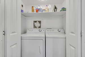 Laundry area with washing machine and clothes dryer