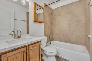 Bathroom featuring washtub / shower combination and vanity