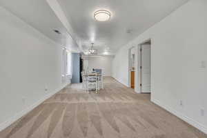 Dining room featuring light colored carpet