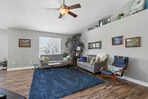 Living area featuring wood finished floors and ceiling fan