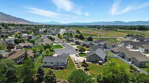 Aerial view of residential area featuring a mountainous background