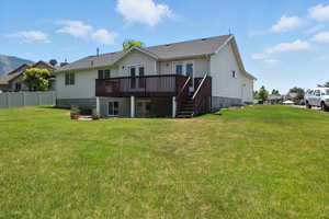 Rear view of house with french doors, a wooden deck, and stairs