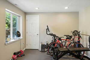 Workout area with recessed lighting and baseboards