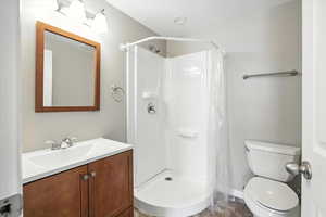 Full bath featuring vanity and a shower with shower curtain