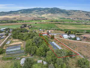 View of rural area with property parcel outlined and a mountain backdrop