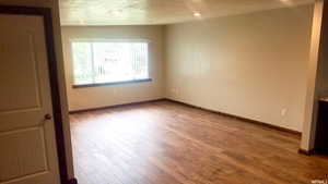 Unfurnished room featuring wood finished floors