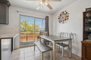 Dining room featuring ceiling fan and light tile patterned flooring
