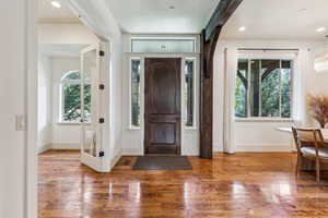 Entryway featuring wood finished floors and recessed lighting
