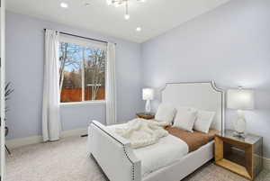 Carpeted bedroom featuring baseboards and recessed lighting