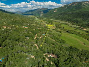 Aerial overview of property's location with mountains