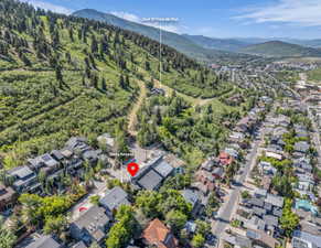 View of property location featuring a mountainous background and nearby suburban area