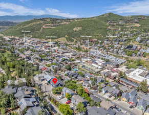 Aerial view of property's location featuring mountains