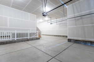 Garage featuring a garage door opener