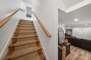 Wood & carpet stairs w/double rails