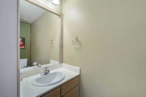 Bathroom featuring vanity and toilet