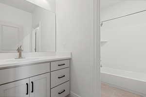 Full bath with vanity and tub / shower combination