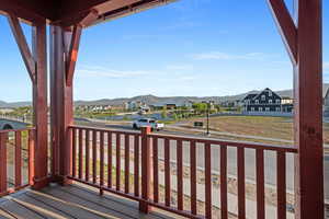 Wooden terrace featuring a mountain view