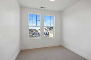 Unfurnished room featuring carpet