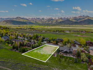 Aerial overview of property's location with mountains and property parcel outlined