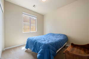 Bedroom with carpet and baseboards