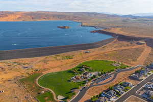 Aerial view of property and surrounding area with a water and mountain view