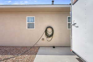 View of exterior entry with stucco siding