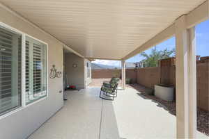 Fenced backyard featuring a patio area
