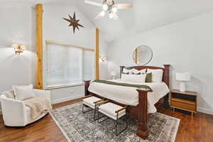Bedroom featuring vaulted ceiling, wood finished floors, and ceiling fan