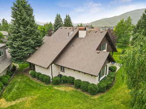 View of subject property featuring a mountainous background