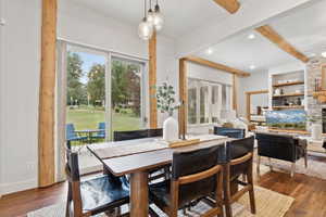 Dining room with beam ceiling, ceiling fan, dark wood-style floors, and recessed lighting