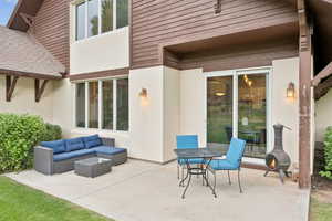 View of patio with an outdoor hangout area and outdoor dining space