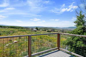 Balcony with a mountain view and a view of countryside