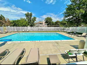 Community pool with a patio area