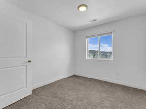 Unfurnished room featuring carpet flooring and baseboards