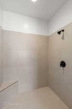 Bathroom with a tile shower