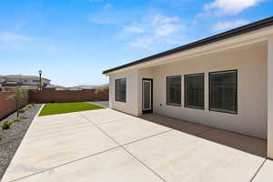 Fenced backyard featuring a patio area