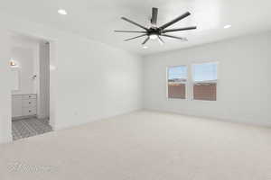 Unfurnished room featuring light colored carpet, ceiling fan, and recessed lighting