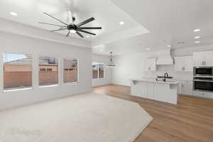 Unfurnished living room featuring recessed lighting, light wood-style floors, and ceiling fan