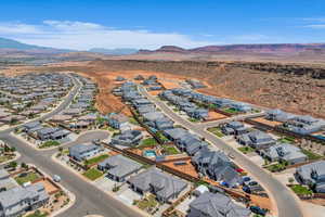 Aerial overview of property's location with mountains and nearby suburban area