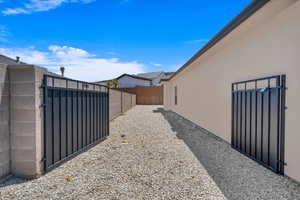 View of yard featuring a gate