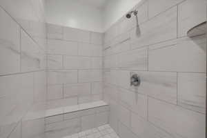 Bathroom with tiled shower