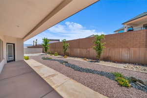 Fenced backyard featuring a patio
