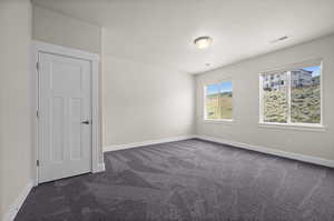 Expansive Second-Level Bedroom Overlooking the Surrounding Natural Beauty