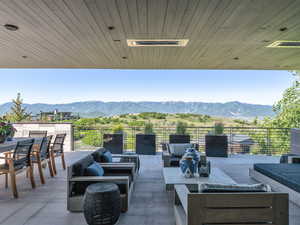 View of patio with a mountain view and outdoor lounge area