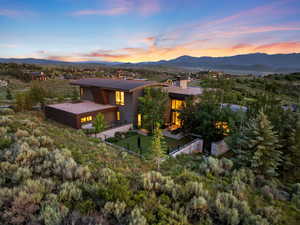 Rear view of property with a mountain view