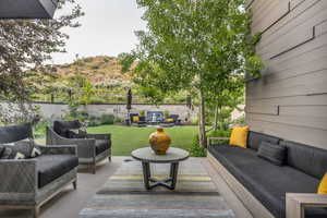 View of patio featuring an outdoor hangout area and a mountain view